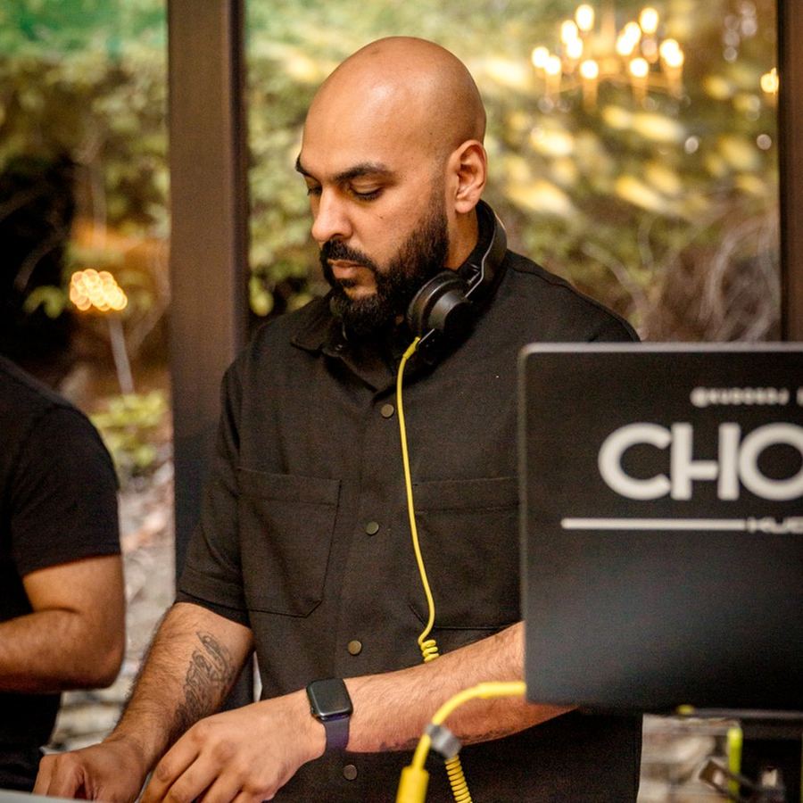 DJ Chonkx behind the decks DJing at a wedding